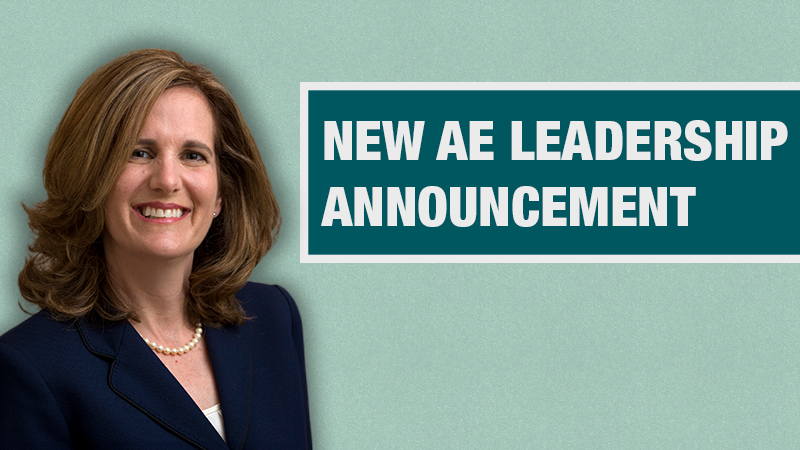 Graphic with a light teal background showing a person in a navy blazer beside a dark teal box containing the text ‘New AE Leadership Announcement.’