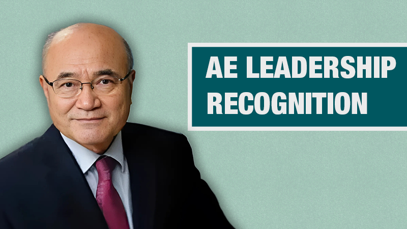 Graphic with a light teal background showing a person in a black blazer beside a dark teal box containing the text ‘AE Leadership Recognition.’