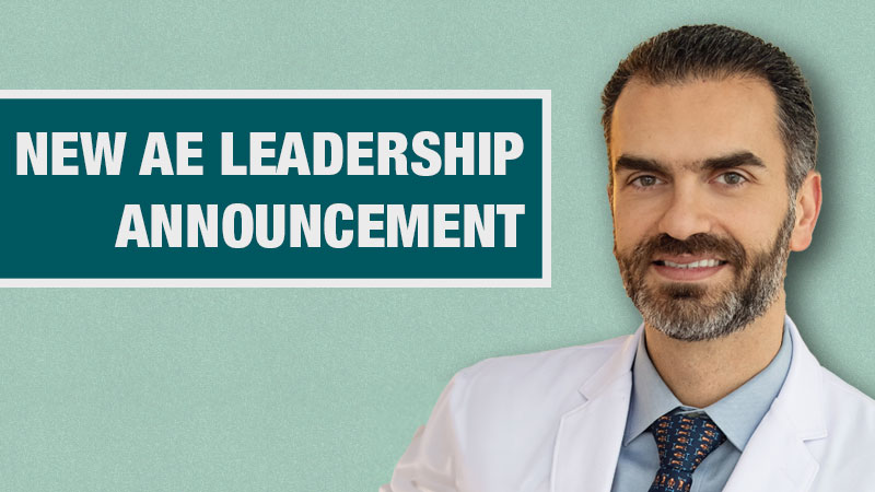 Graphic with a light teal background showing a person in a white lab coat beside a dark teal box containing the text ‘New AE Leadership Announcement.’