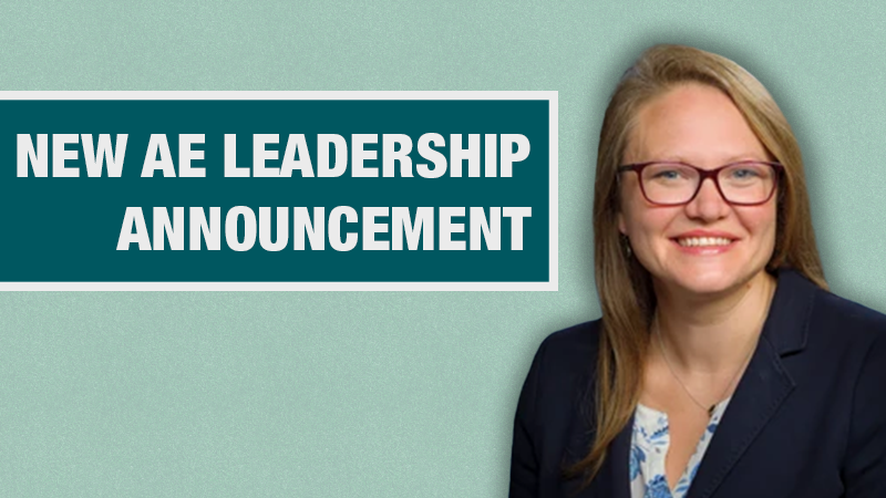 Graphic with a light teal background showing a person in a navy blazer beside a dark teal box containing the text ‘New AE Leadership Announcement.’