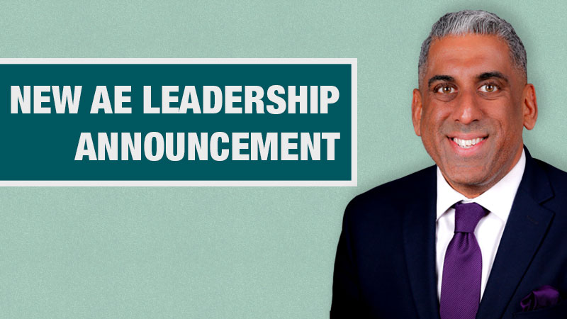 Graphic with a light teal background showing a person in a black blazer beside a dark teal box containing the text ‘New AE Leadership Announcement.’