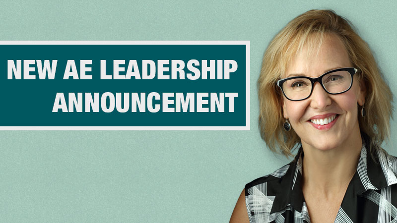 Graphic with a light teal background showing a person in a black and white shirt beside a dark teal box containing the text ‘New AE Leadership Announcement.’