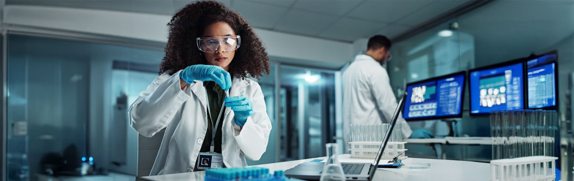 Woman, scientist or blood vial for testing in laboratory, healthcare or pathology to label on test tube. Biotechnology, pharmaceutical and laptop by doctor and online scientific results in phlebotomy