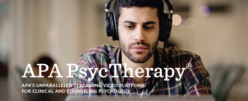 Picture of man wearing headphones with laptop