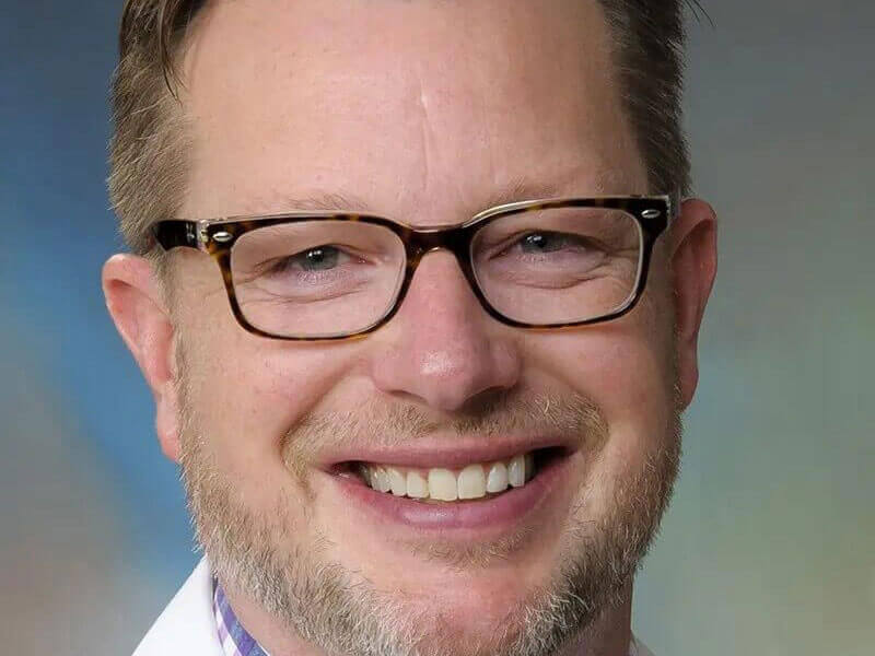 Professional portrait of Zachary Carson.