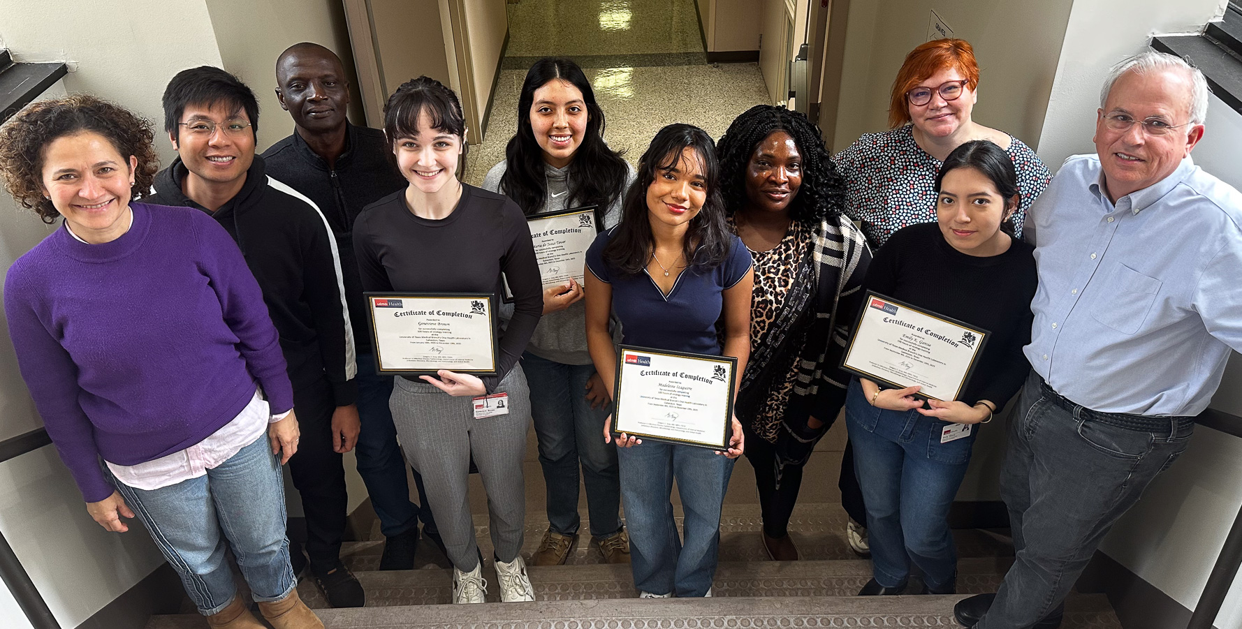 Hand over Certificate of Completion to trainees from Galveston College