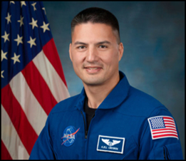 A professional headshot of Dr. Lingren wearing NASA jumpsuit