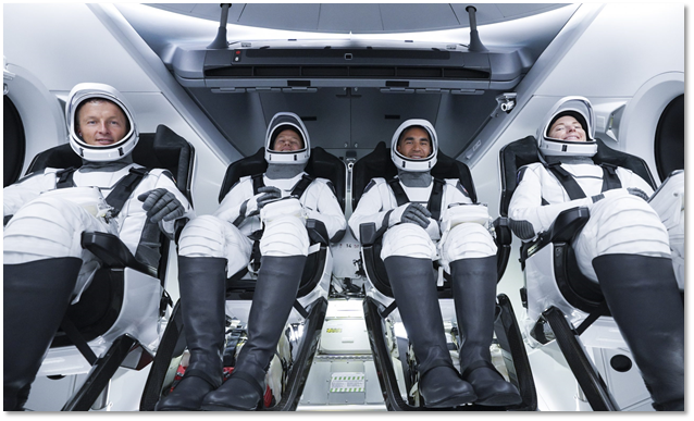 A shot of four astronauts on a SpaceX mission seated on the space vehicle