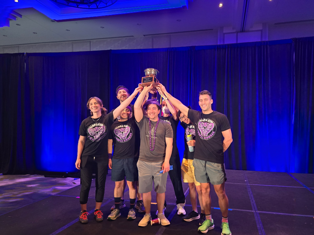 UTMB residents in aerospace medicine hold up the RAM Bowl in victory.