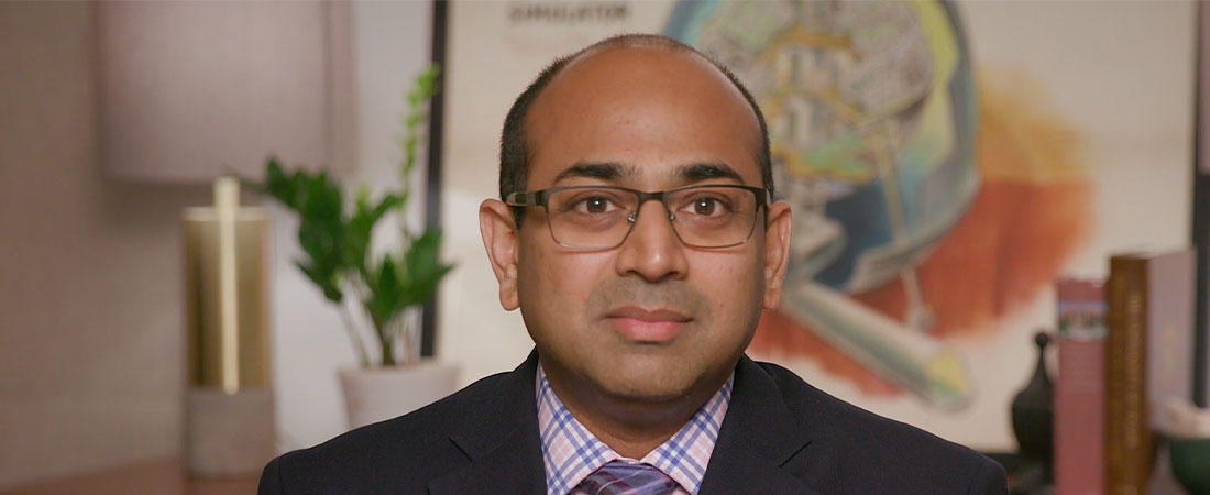 A close-up photo of Dr. Shah looking at the camera