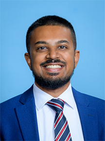 A professional headshot of Dr. Murugesan.
