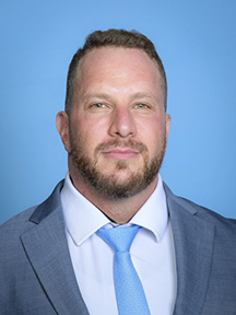 A professional headshot of Joshua Nowitz