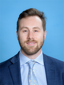 A professional headshot of Dr. Roche.