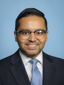 A professional headshot of Brian Rodriguez