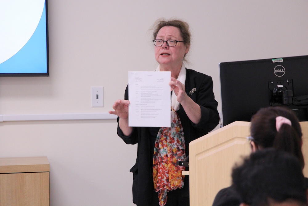 1 Presenter holding document