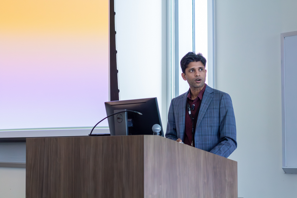 Dr. Vibhuti Gupta presenting at a podium