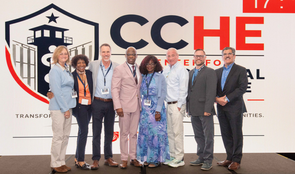 From left, Kristen Peek, Patricia Blair, Jacques Baillargeon, Olugbenga Ojo, Lannette Linthicum, Owen Murray, Jeff Farroni and Joseph Penn pose together at the CCHE Symposium.