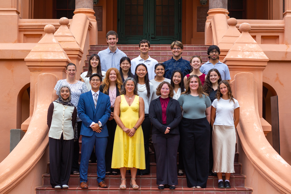 The 2026 SIBDS cohort and mentors pose together on the steps of a UTMB building.