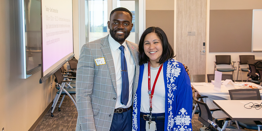 An MPH alumni poses with his former advisor