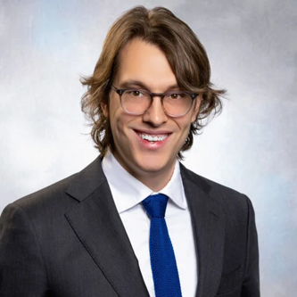 A professional headshot of Kevin Pritchard.