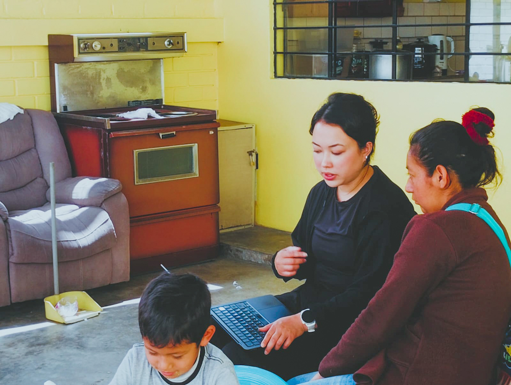 Briana Nguyen administering survey Briana administers a survey