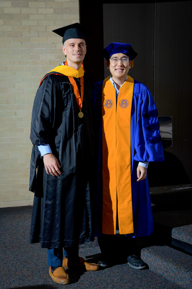 Griffin Baillargeon with Dr. Jeong Hoon Jang at UTMB graduation