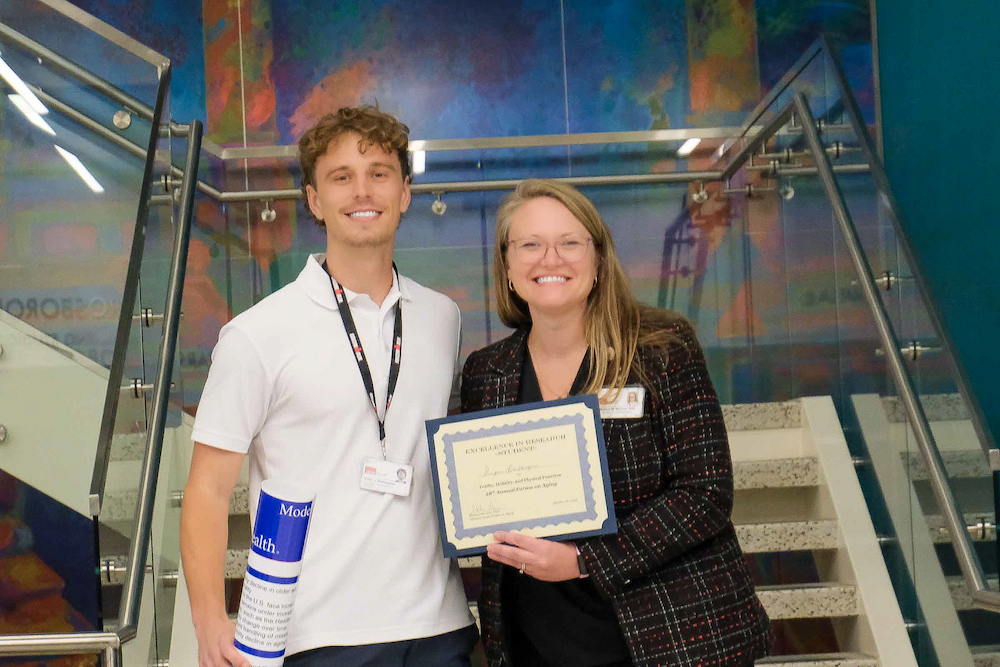 Griffin Baillargeon with Dr. Melissa Morrow at the Annual Forum on Aging