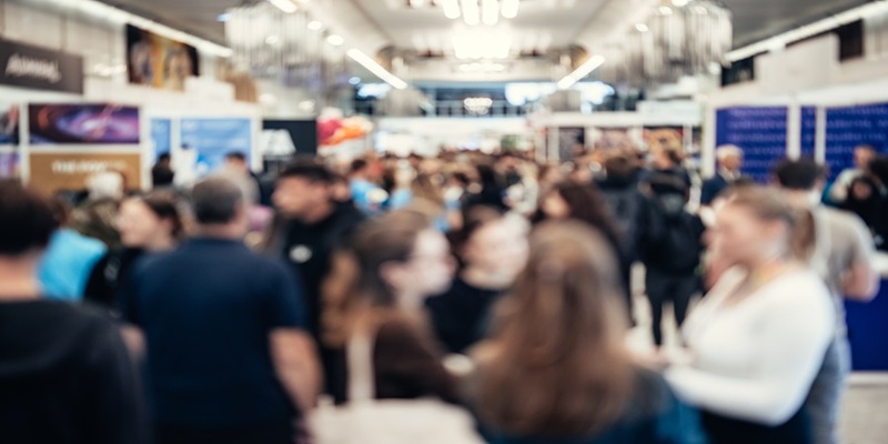 Conference attendees walking to exhibits