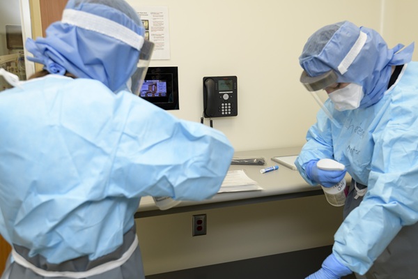 Healthcare personnel decontaminate after training