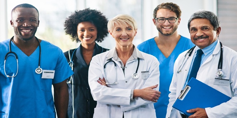 group of healthcare workers pose for a picture