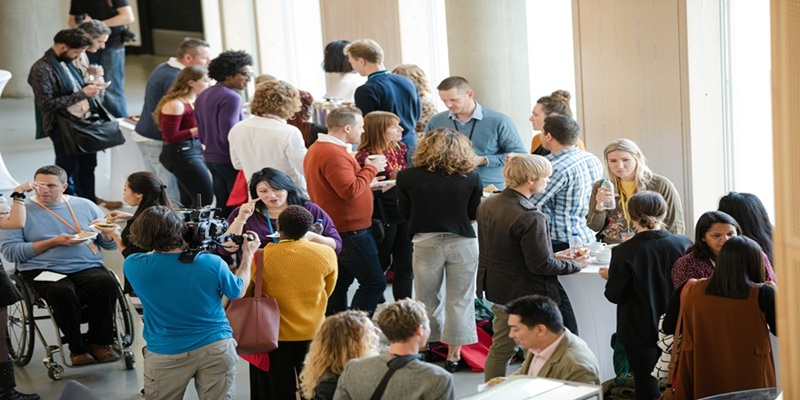 Group of people at conference talking