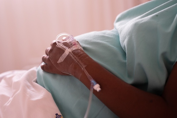 pregnant woman on hospital bed