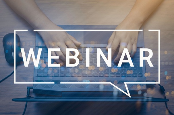 Webinar wording across picture of laptop keyboard