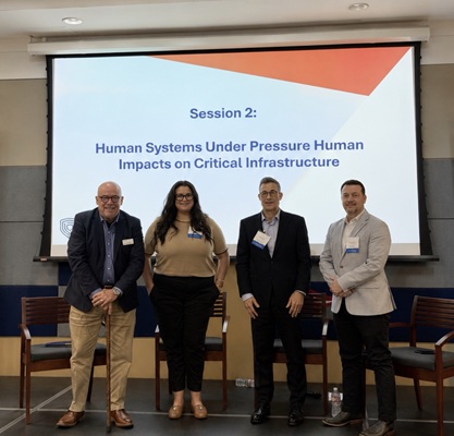 Kara Marshall with presenters at conference