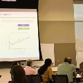 Dr. Vinnet Mencahery speaks to conference attendees