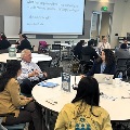 conference attendees participate in round table discussion
