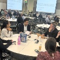conference attendees participate in round table discussions