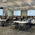 conference attendees listen to speaker
