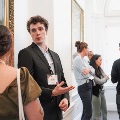 Symposium attendees talk about posters