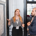 poster presenter speaks with conference attendees