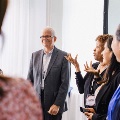 Dr. Melby speaks with conference attendees