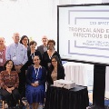 symposium attendees pose for picture