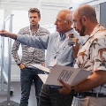 judges react and discuss to poster presentations