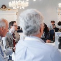 group of conference attendees speak about conference