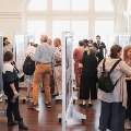 group of judges and attendees view posters
