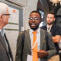 Dr. Melby speaks to conference attendee