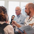 poster judges and presenters speak with attendees