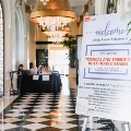 symposium poster on easel