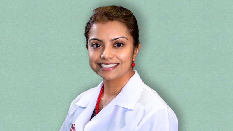 Photo of Dr. Nausheen Jamal on a teal background