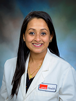 Headshot of Dhanya Vijayakumar